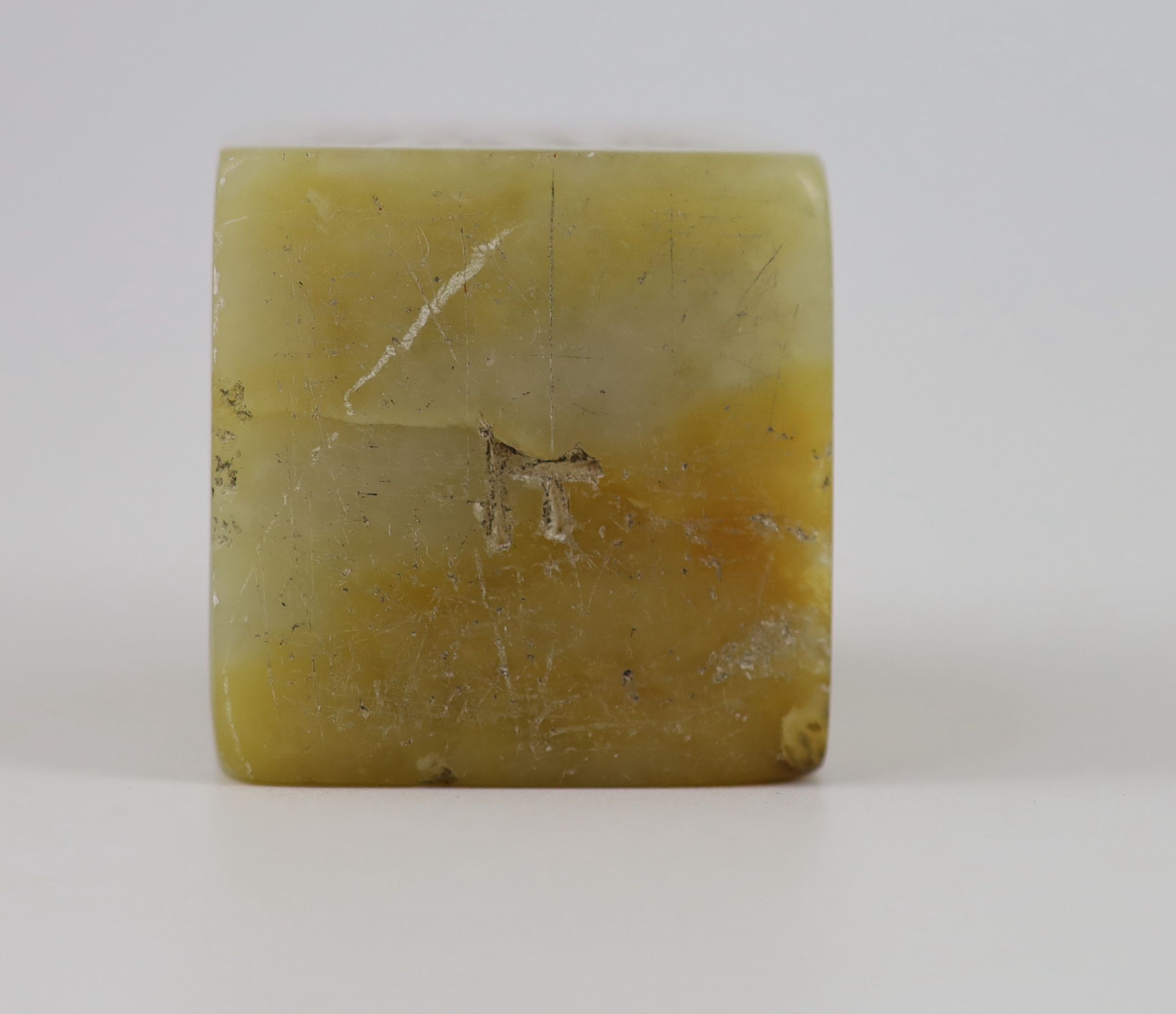 A Chinese cream and russet soapstone square seal, 5.2 cm high